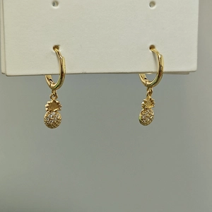 Elegant gold pineapple drop earrings with micro-paved cubic zirconia and hoop closure