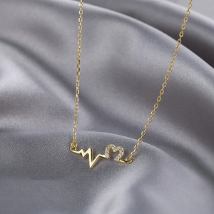 Elegant 925 silver gold-plated heart necklace with ECG pattern and cubic zirconia