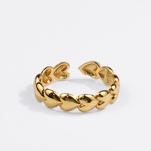 Detailed view of S925 stamped inner band on a gold adjustable heart ring