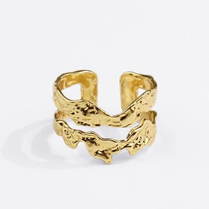 Detail of gold open ring featuring unique double-layer design and irregular lava texture