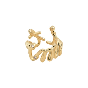 Detailed view of an irregular gold-plated ring featuring an M-letter shape and small zircons