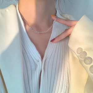 Close-up of minimalist S925 sterling silver snake chain necklace on a model
