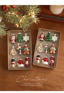 Detailed view of nine miniature hand-painted glass Christmas ornaments in a gift box