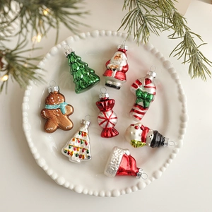 Set of 8 festive glass Christmas ornaments with Santa and Snowman in a ceramic plate