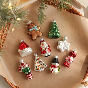 9-piece set of mini Christmas glass ornaments with festive snowman and tree shapes