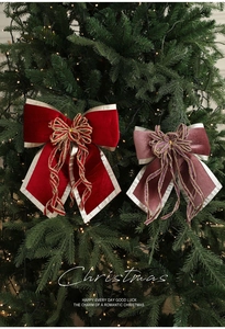 Detail of red and pink velvet Christmas tree bows with glitter edges and tassels