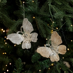 Glittery gold and silver butterfly Christmas tree hanging ornaments with warm star lights