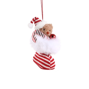 Plush Christmas bear in a red and white striped holiday boot with a festive santa hat