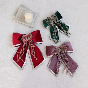 Three-piece velvet Christmas bow set in wine red, green, and purple with silver edges