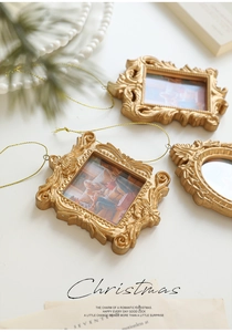 Detailed view of vintage Baroque gold mini photo frames with ornate embossed textures