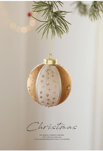 Close-up of 8cm gold and brown Christmas foam ball with velvet texture and sequins