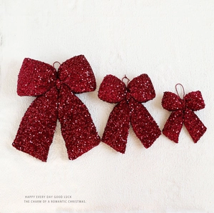 Three-piece set of burgundy sequined Christmas bow ornaments in various sizes