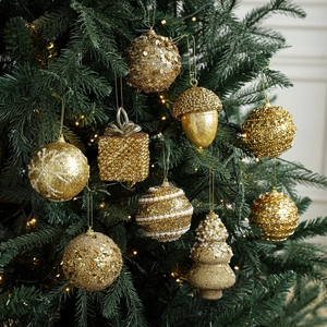 Golden Christmas ball ornaments set with glitter and pearls on a green pine tree