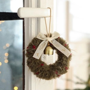 Plush Christmas wreath hanging ornament with a ribbon bow and a golden metal bell decoration