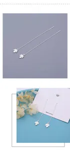 Detail view of silver maple leaf threader earrings with delicate leaf veins and long chains