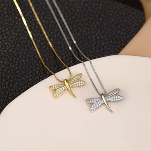 Elegant gold and silver dragonfly pendant necklace with micro-paved zircons on box chain