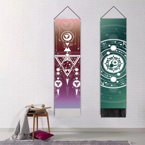 Minimalist moon phase and celestial tapestry with tassels hanging on a white brick wall