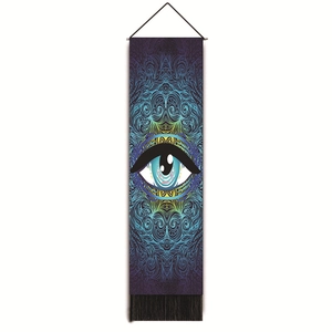 Detail of bohemian mandala eye wall tapestry with deep purple patterns and black tassels