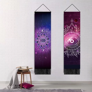 Ethnic bohemian evil eye wall tapestry with geometric patterns and black bottom tassels
