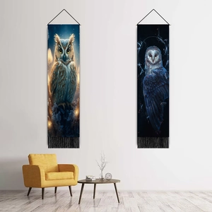 Nordic owl pattern wall tapestries with black tassels in a cozy living room setting