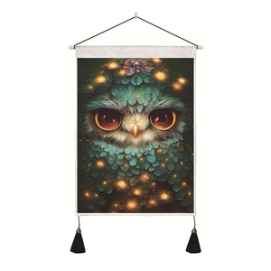 Detail of owl wall hanging with intricate feather textures and decorative black tassels