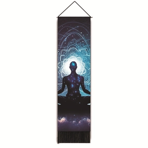 Close-up of meditation tapestry with blue nebula silhouette and black tassels detail