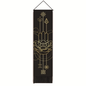 Detail of Hamsa Hand and spiritual symbols on black tapestry with gold tassels