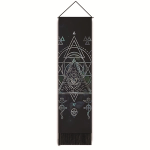 Detailed view of black tapestry with celestial eye, geometric lines, and fringe tassels
