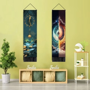 Detail view of starry sky and clock art tapestry with black tassels on green wall