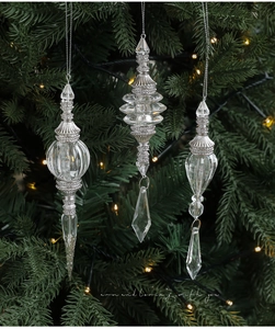 Three-piece clear acrylic icicle Christmas ornaments with silver caps on a tree