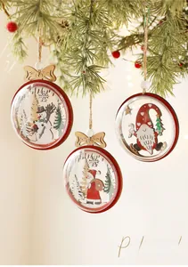 Close-up of wooden Christmas ornaments featuring Santa and snowman on pine branches