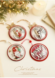 Detail of wooden Christmas ornaments with Santa and Snowman figures in a cozy setting