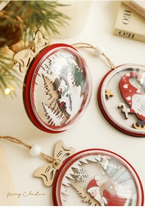 Detail of wooden Christmas ornaments with clear domes featuring Santa and snowmen scenes