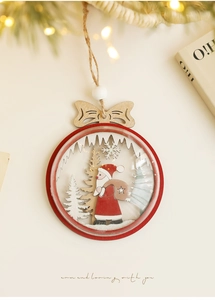 Close-up of wooden Santa ornament with 3D forest scene and natural jute rope hanger