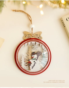 Macro detail of a wooden Christmas tree ornament featuring a snowman and red frame