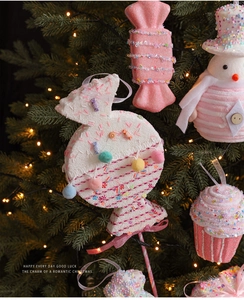 Pink Christmas tree ornaments in macaron candy shapes with sparkling glitter details