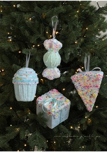Set of four light blue foam sweets ornaments with colorful beads on a Christmas tree