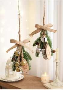 Detail of Christmas ornament featuring pine cones, burlap bow, and vintage wood star charm