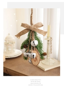 Detail of Christmas hanging ornament with silver bells, pine cone and wood chip