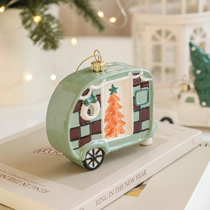 Retro green camper Christmas tree ornament with holiday tree and plaid patterns