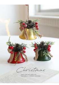 Detailed view of Christmas iron bells with pine cones, red berries and jute bow accents