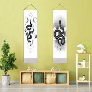 Detail of mystical moon eclipse snake tapestries on a light green modern wall