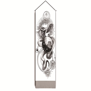 Close-up of black and white snake tapestry with planetary motifs and hanging rods