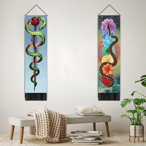 Artistic snake and floral wall tapestry set with tassels on a minimalist white wall