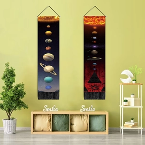 Close-up of lunar eclipse tapestry with black fringe hem and solar system pattern
