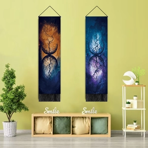 Detail of hanging wall tapestries with tassels and abstract nature forest prints