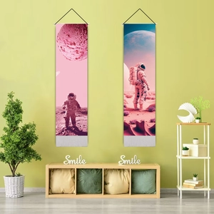 Detailed view of pink astronaut wall tapestries with hanging rods in a modern room decor