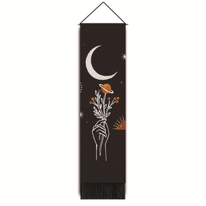 Detail of minimalist moon and stars printed wall tapestry with decorative bottom fringes