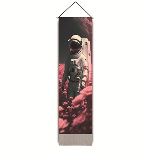 Macro view of pink astronaut wall tapestry featuring tassels and metallic bottom bar