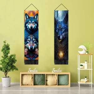Close-up of decorative 3D wolf art tapestries with premium fringe tassels on green wall